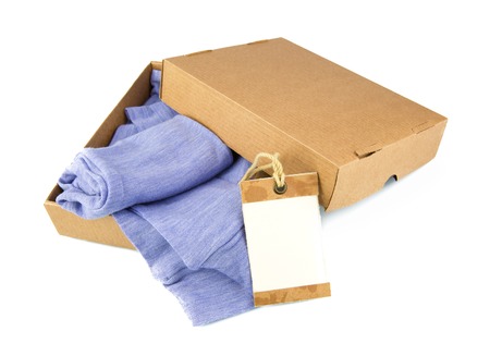 Clothes in open containers with card isolated on white backgroundの写真素材