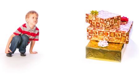 Little boy with presents isolated on white backgroundの写真素材
