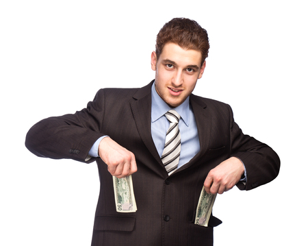 Lucky man put money in his pocket isolated on white backgroundの写真素材