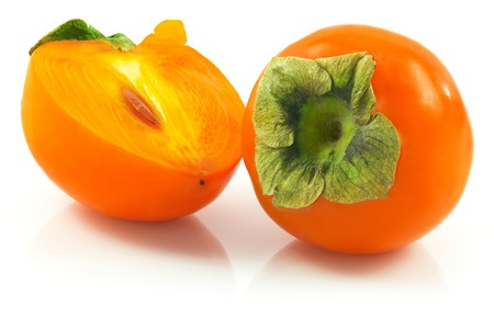 Macro view of ripe persimmon isolated on white backgroundの写真素材