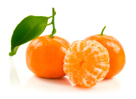 Tangerine with green leaves isolated on white backgroundの写真素材