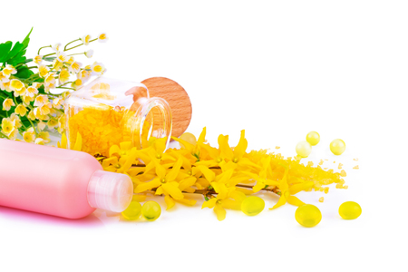 Macro view of spa product with spring flowers isolated on white backgroundの写真素材