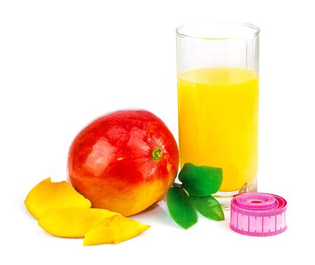 Mango juice in glass, mango fruit with centimeter and leaves isolated on white backgroundの写真素材