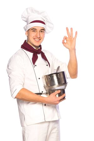 Portrait of smiling cook chef with kitchenware isolated on white backgroundの写真素材