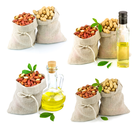 Macro view of purified and raw peanut in flax sack and glass bottle of oil with leaves, setの写真素材