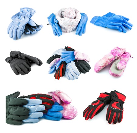 Multicolored mixed ski gloves varied in size and knitted hat isolated on white background, setの写真素材