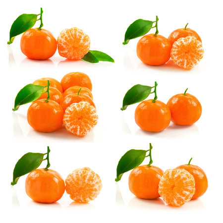 Macro view of group of ripe tangerine with green leaf isolated on white background, setの写真素材