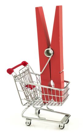 Business concept with clothes peg in the shopping cart isolated on white backgroundの写真素材