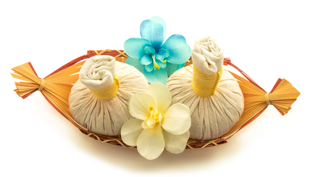 Pouches, flowers orchid, a basket isolated on white backgroundの写真素材