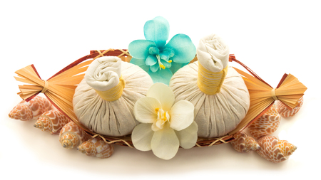 Pouches, decorative flowers orchid, shells, a basket isolated on white backgroundの写真素材