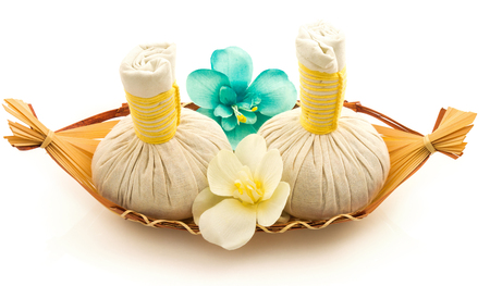 Pouches, decorative flowers orchid, a basket isolated on white backgroundの写真素材