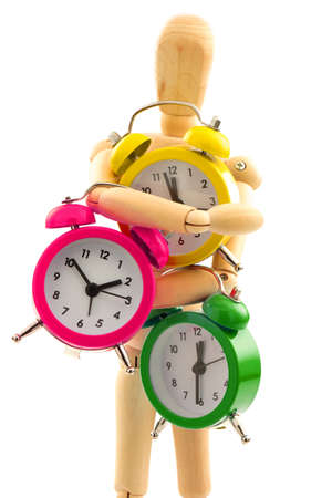 Concept with wooden toy with multicolored clocks on white backgroundの写真素材