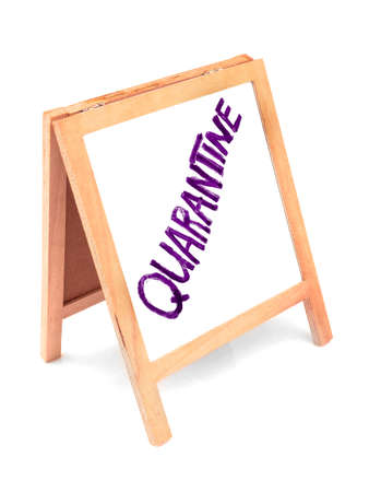 Coronavirus concept with text quarantine, announcement on wooden white board, blackboard, chalkboard, frame. Isolated on white background.の写真素材