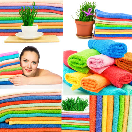 Set of multicolor towels, fresh green grass with ribbon, white cup of tea and young beautiful girlの写真素材