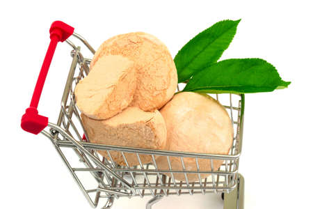 Macro view of group of homemade natural apple three marshmallows with green leaves in metal trolley cart. Isolated on white background.の写真素材