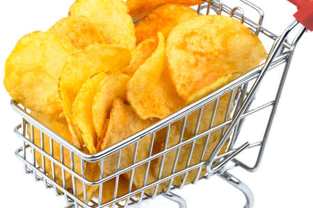 Macro view of heap, group of tasty crisp potato chips, snack in metal trolley, cart on white backgroundの写真素材
