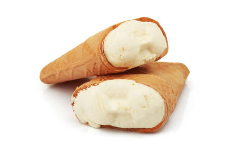 Two tasty milky ice cream cone in crisp waffle cup isolated on white backgroundの写真素材