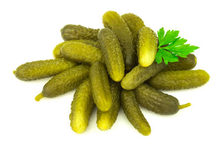 Salted marinated pickled cucumbers with fresh parsley isolated on white backgroundの写真素材