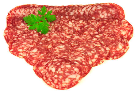 Group of thin slices of french dry salami and fresh parsley isolated on white backgroundの写真素材