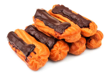 Group of tasty French dessert eclairs with custard and chocolate icing isolated on white background. Sweet pastry products.の写真素材