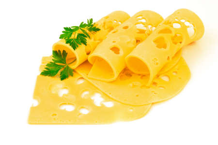 Rolled thin slices of hard yellow cheese with holes and fresh parsley isolated on white backgroundの写真素材