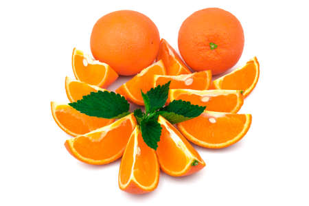 Orange with slices and fresh green leaf of mint isolated on white backgroundの写真素材