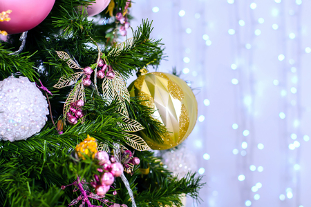 Christmas and New Year Decoration. Bauble on Christmas Tree. Abstract christmas background with defocused lights.の写真素材