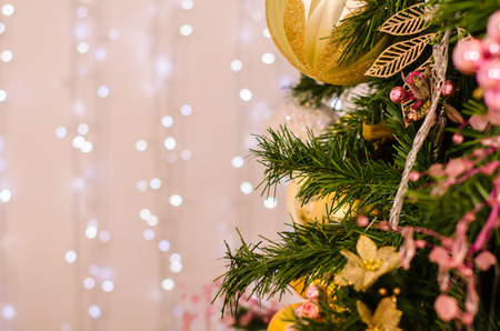 Christmas and New Year Decoration. Bauble on Christmas Tree. Abstract christmas background with defocused lights.の写真素材