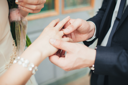 wearing wedding ring ceremony tradition. wedding concept.の写真素材