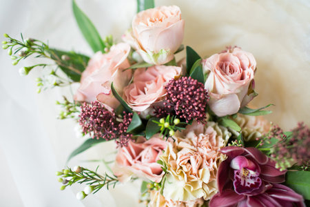 Close-up beautiful luxury bouquet of mixed flowers in glass vases. Bouquet of roses, carnations and...