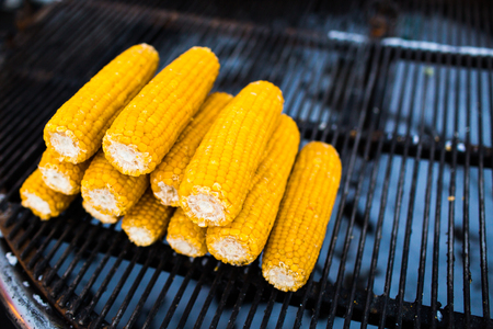 Organic Grilled Corn on the Cob Ready to Eat. Grilled corn with thai butter. Fried corncobs on a grid. Healthy food.の写真素材
