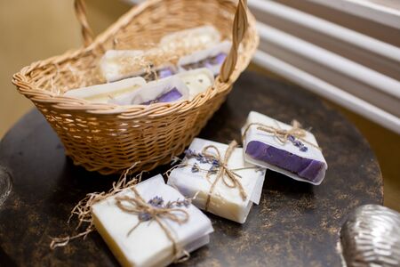 Lavender soap and salt in a wicker basket. A gift for guests.の写真素材