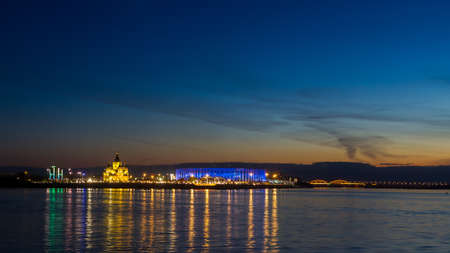 Night view of Nizhny Novgorod from the Volga River, a church, a bridge with a Russian city with illumination.の写真素材