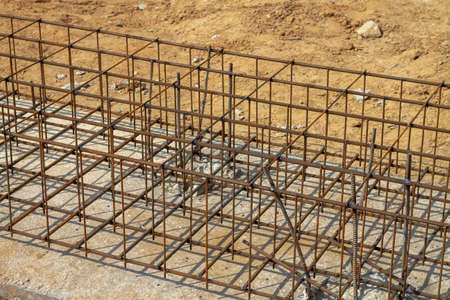 Grating made of steel rods for the foundation of a house on a construction site.の写真素材