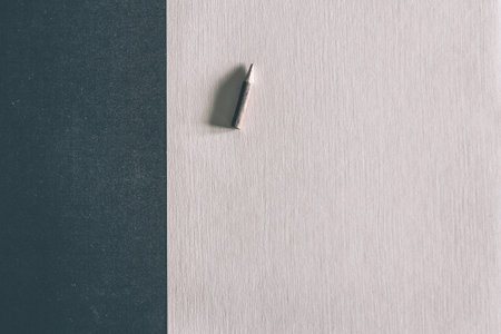 Template with copy space on top of a close-up photo of a wooden pencil.