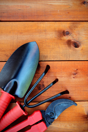 Gardening tools and objects on old wooden backgroundの写真素材