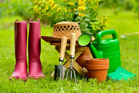 Gardening tools on green background and grassの写真素材