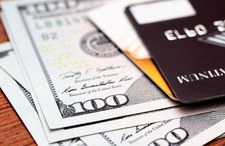 Close-up credit cards on dollars notes with shallow depth of fieldの写真素材