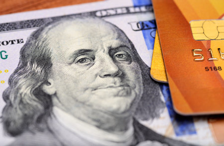 Close-up credit cards on dollars notes with shallow depth of field