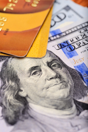 Close-up credit cards on dollars notes with shallow depth of fieldの写真素材