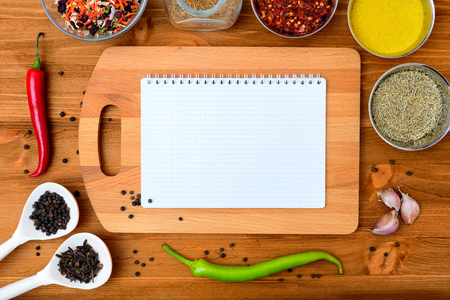 Copyspace food frame with notepad paper spices and cooking accesoriesの写真素材
