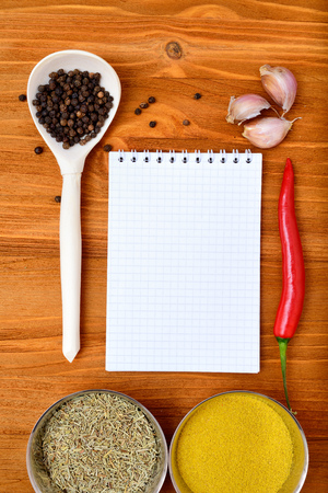 Copyspace food frame with notepad paper spices and cooking accesoriesの写真素材