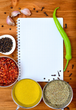 Copyspace food frame with notepad paper spices and cooking accesoriesの写真素材