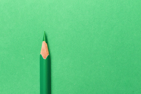 Green pencil on green backgroundの写真素材
