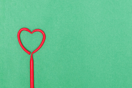 Valentine's Day. The composition of the heart on a green background. Top viewの写真素材