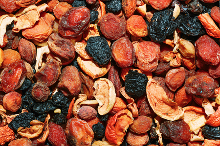 Healthy food. Background of dried fruit. A mixture of dried apricots, pears, raisins, apples, prunesの写真素材
