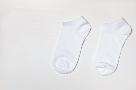 A pair of short socks on a white background with copy space.