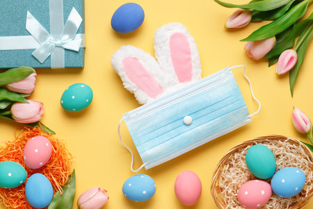 Happy easter. Flat lay greeting card against yellow background.の写真素材