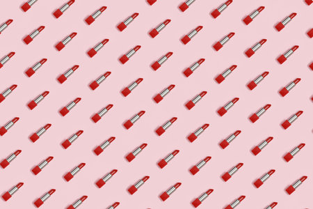 Geometric pattern of red lipstick on a pink background.