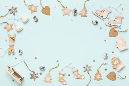 Winter composition with wooden decorations on a blue background.Flat lay top view.